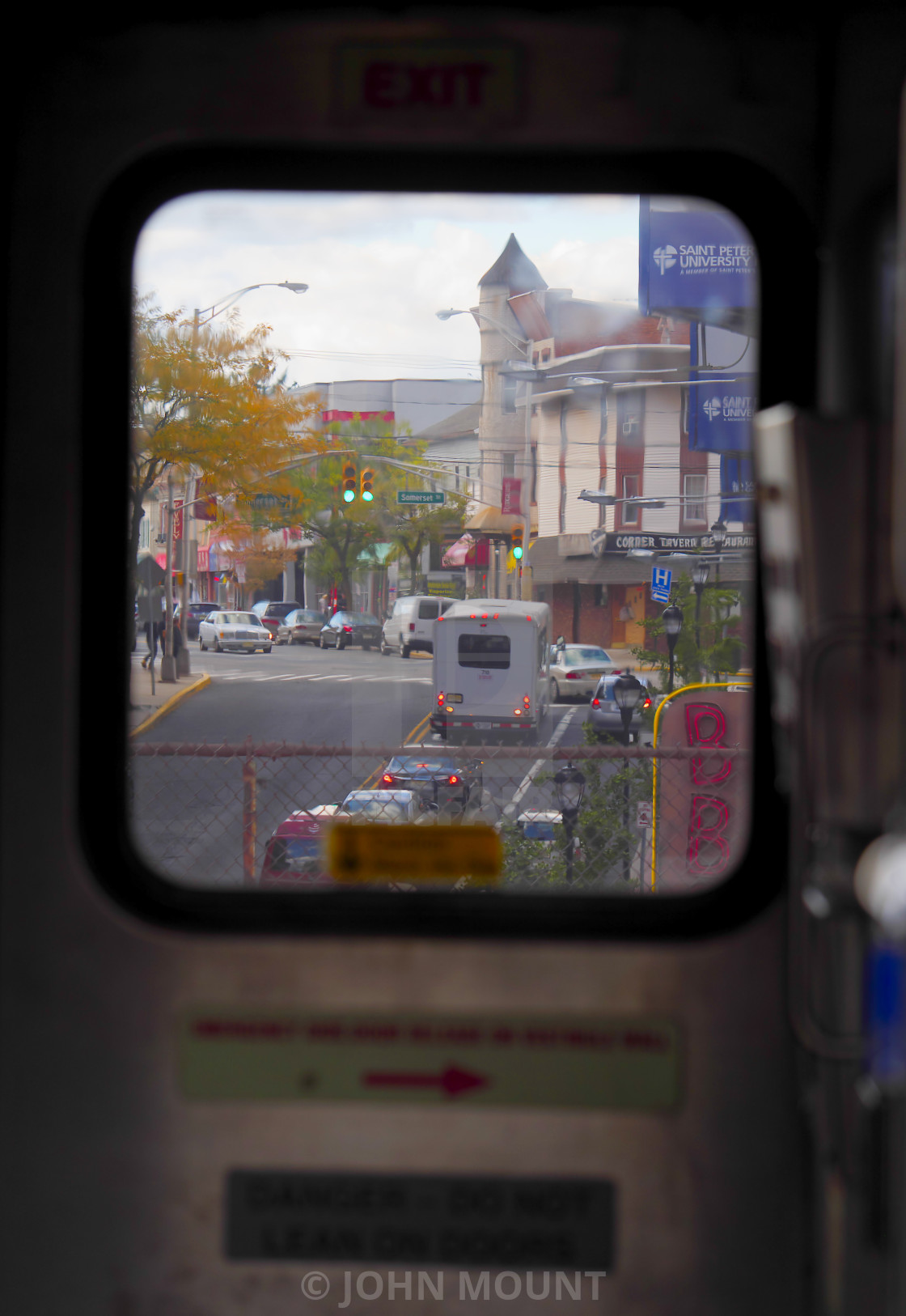 "Through the train window to the street" by JOHN MOUNT - $25.10 "Through the train window to the street" stock image