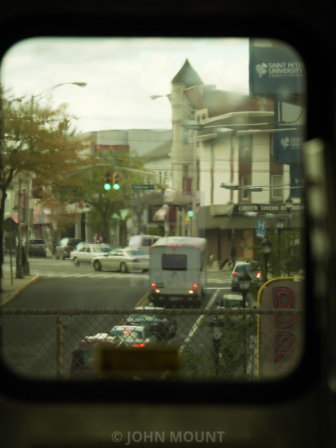 "Through the train window to the street" by JOHN MOUNT - $25.10 "Through the train window to the street" stock image