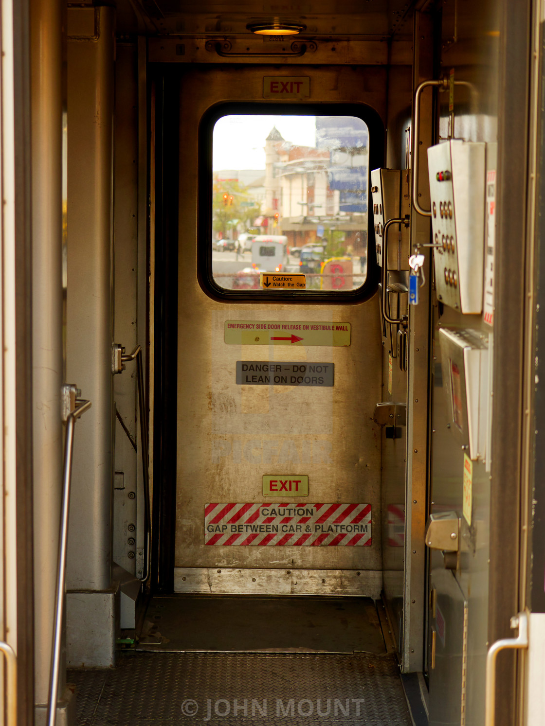 "Through the train window to the street" by JOHN MOUNT - $25.10 "Through the train window to the street" stock image