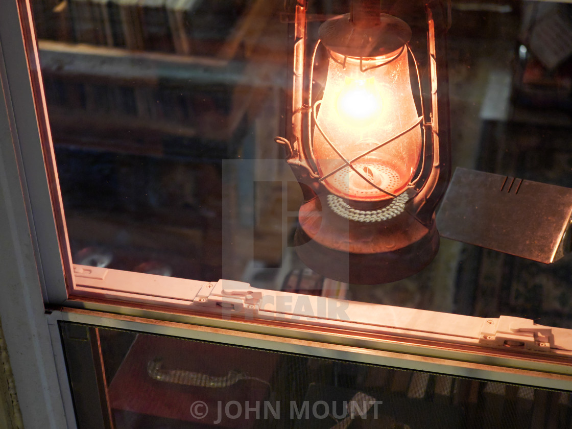 "Lantern in the window of a record store" by JOHN MOUNT - $25.10 "Lantern in the window of a record store" stock image