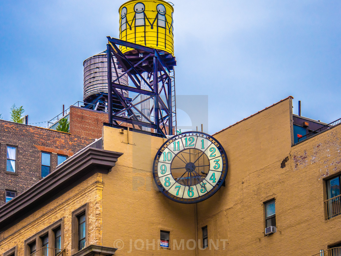 "NYC building with water tower" by JOHN MOUNT - $25.10 "NYC building with water tower" stock image