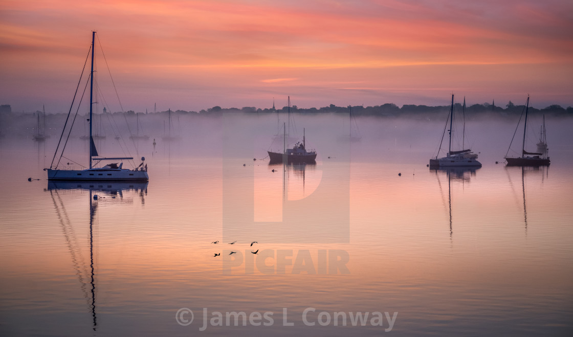 "Ship at anchor at sunrise." by James L. Conway - $15.14 "Ship at anchor at sunrise." stock image