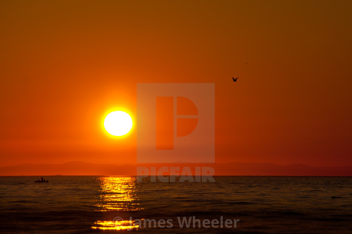 Simple Sun Ball In Orange Sky Over Water License Download Or Print For 7 44 Photos Picfair