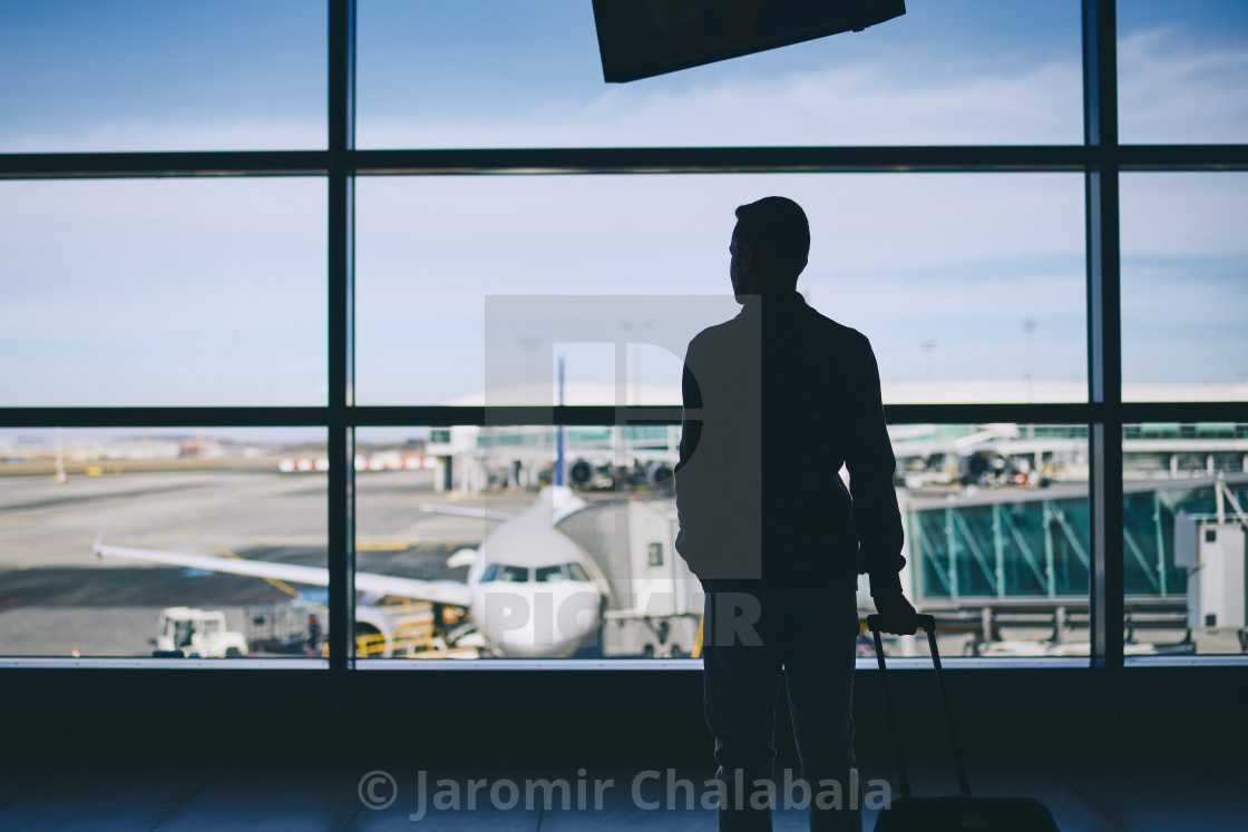 "Traveler in airport terminal" stock image