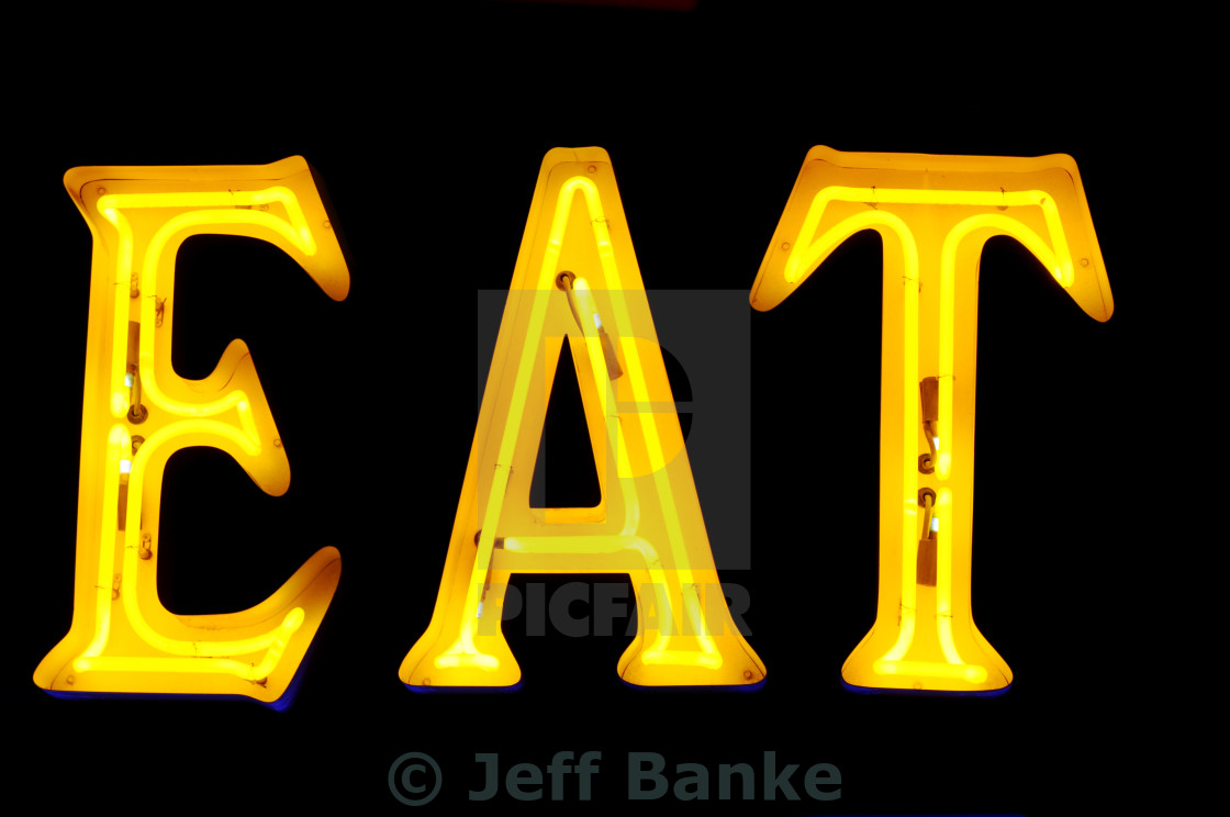 Neon Sign With The Word Eat Over Black License Download Or