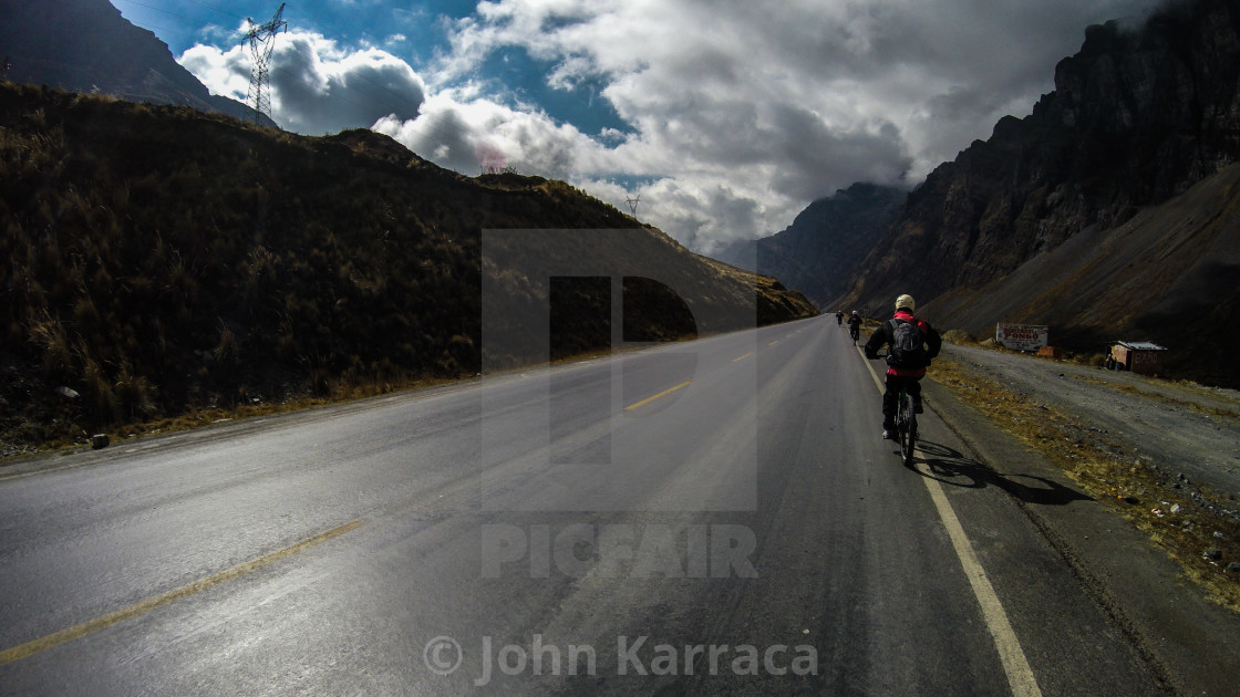 "asphalt road downhill in montainbike on cold mountain roads" by John Karraca - $10.60 "asphalt road downhill in montainbike on cold mountain roads" stock image