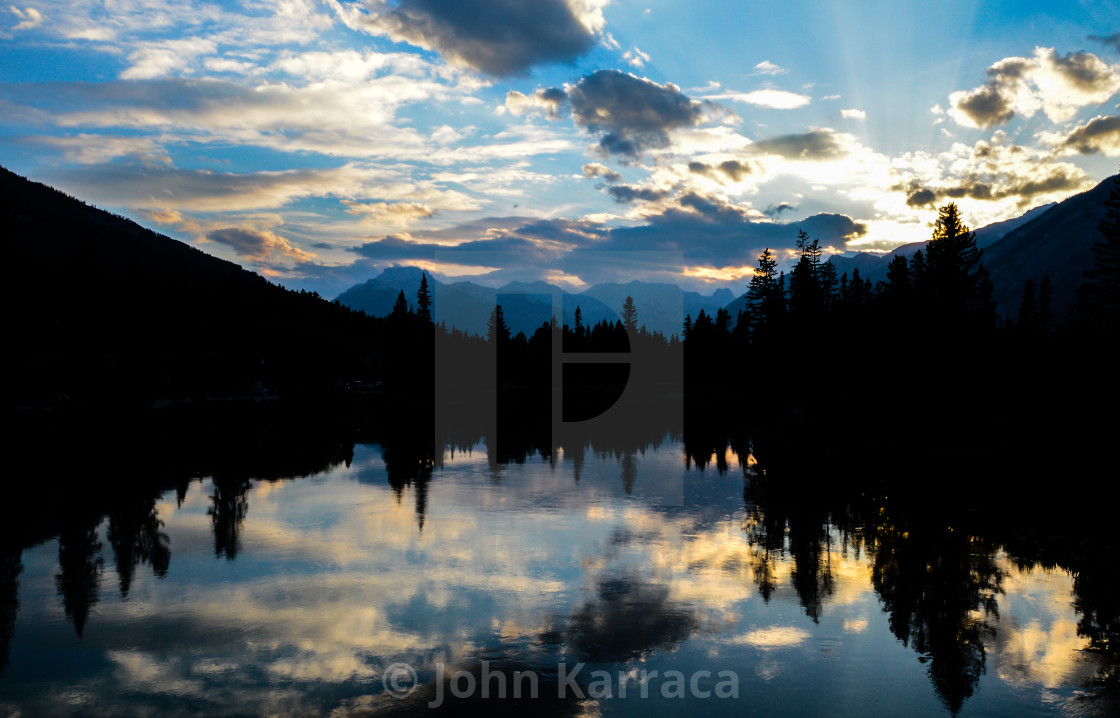 "a perfect silhouette of trees at sunset" by John Karraca - $10.60 "a perfect silhouette of trees at sunset" stock image
