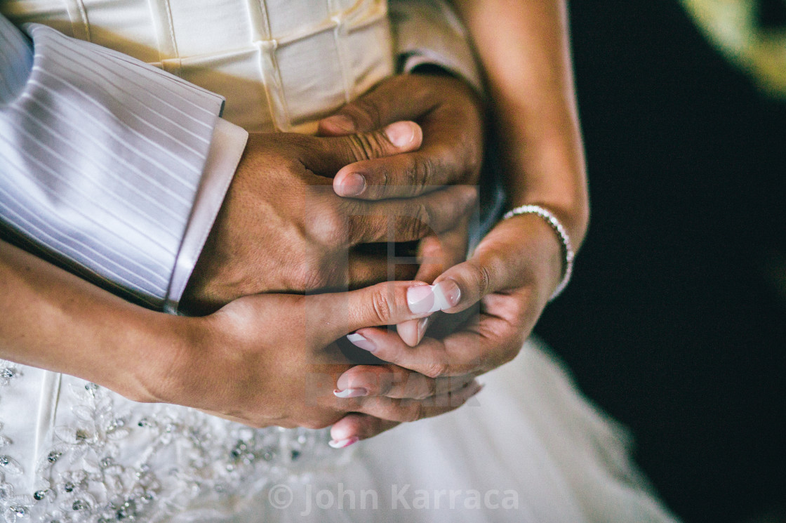 "hands cross in love and protection" by John Karraca - $10.60 "hands cross in love and protection" stock image