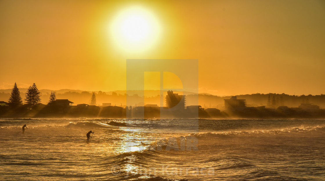 "surfing and sup at sunset on the bay of Melbourne's magical Austalia" by John Karraca - $4.58 "surfing and sup at sunset on the bay of Melbourne's magical Austalia" stock image