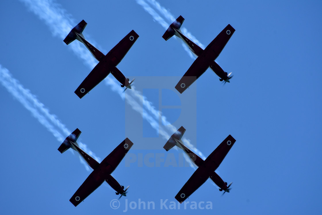 "aeroshow of a f35 produced in Italy in acrobatic evolution" by John Karraca - $4.58 "aeroshow of a f35 produced in Italy in acrobatic evolution" stock image