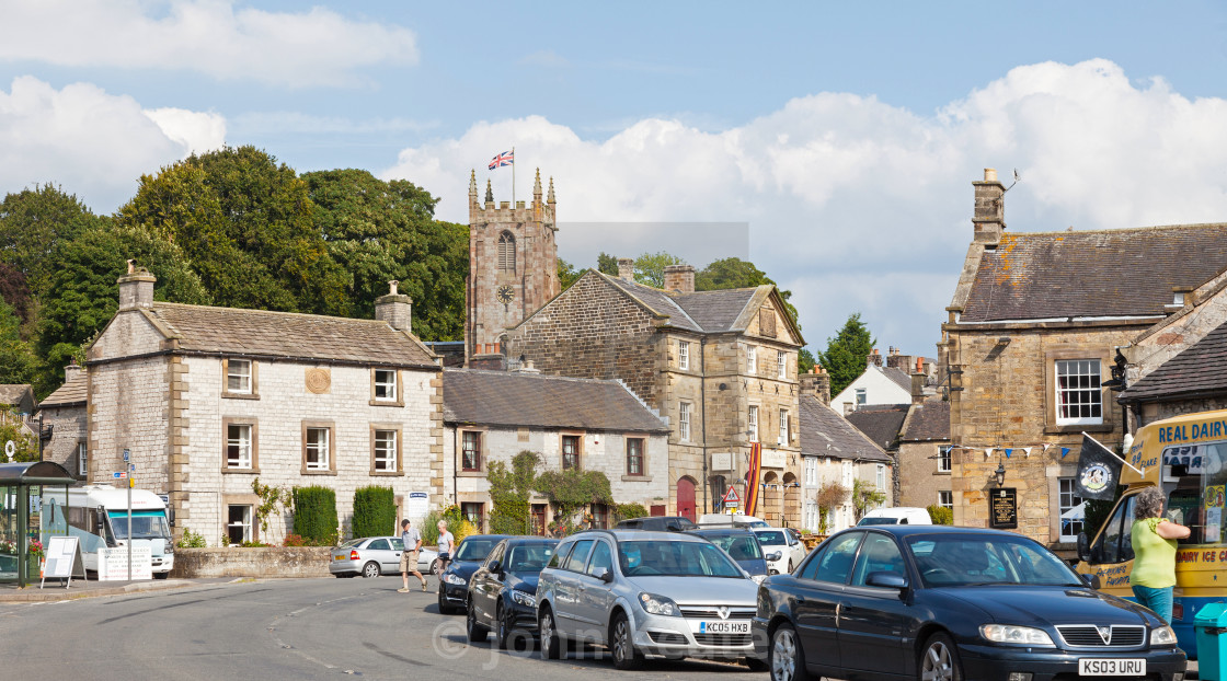 "St. Giles Parish church and the village of Hartington, Derbyshir" stock image