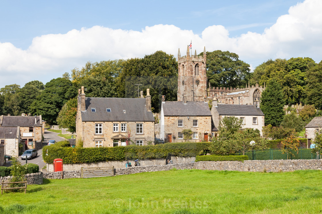 "St. Giles Parish church and the village of Hartington, Derbyshir" stock image