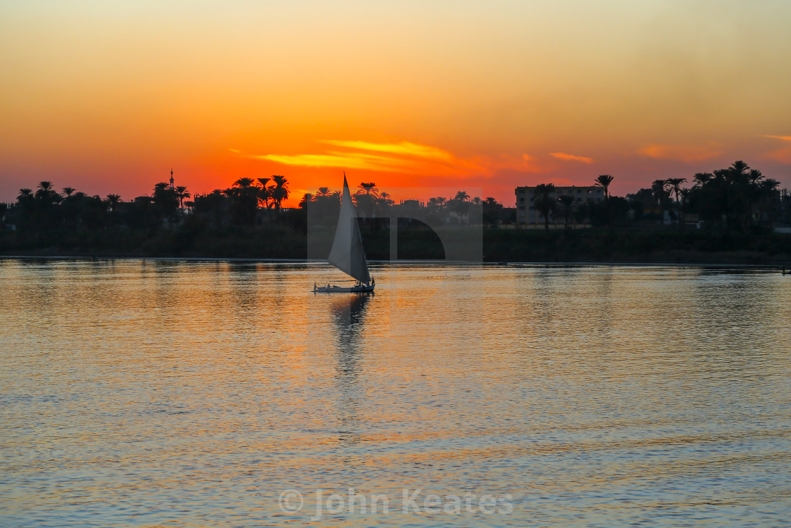 "Sunset on the Nile River with Felucca boat sailing, Luxor, Egypt" stock image