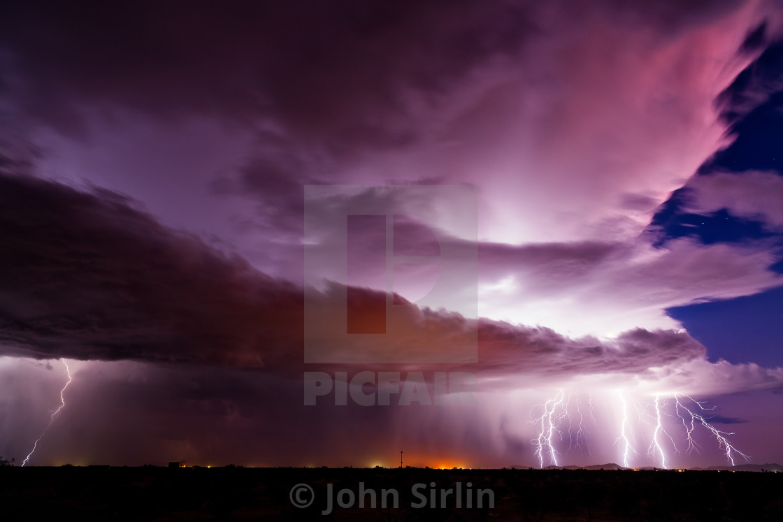 "Lightning bolts strike from a thunderstorm" stock image