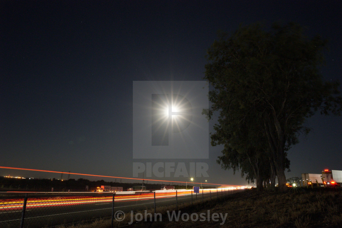 "Full moon over I-5" stock image