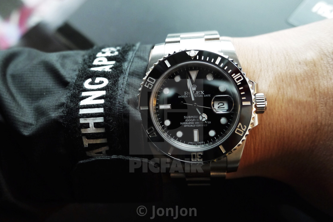 Rolex Submariner 116610LN on wrist. License, download print for £12.40 | Picfair