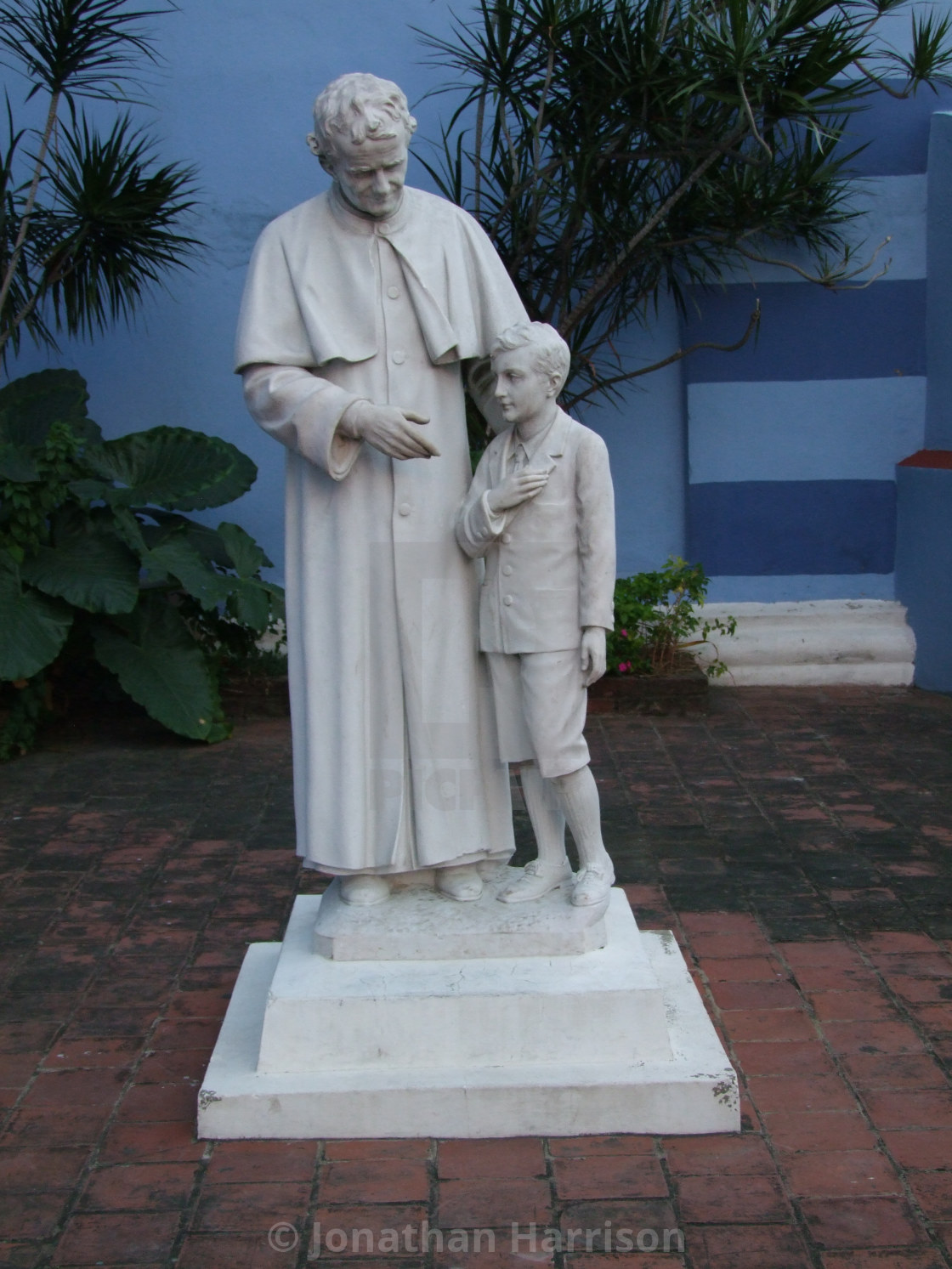 "Statue of a Priest & Child, Santa Clara" stock image