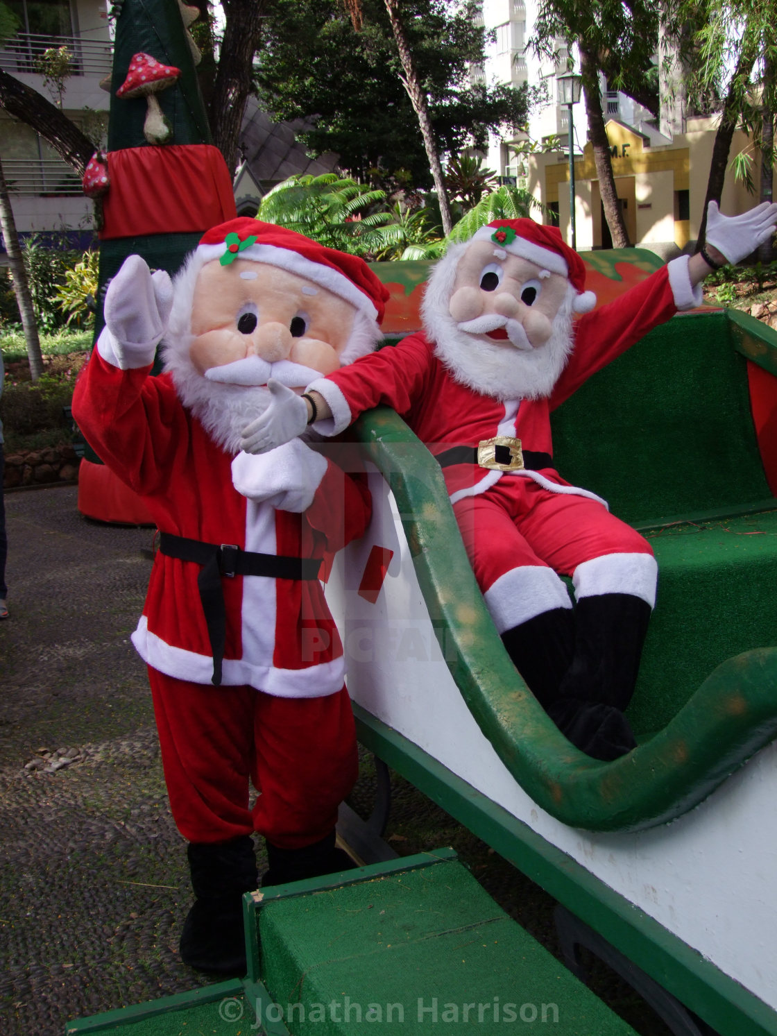 "Two Father Christmases, Jardin Municipal" by Jonathan Harrison - $12.46 "Two Father Christmases, Jardin Municipal" stock image