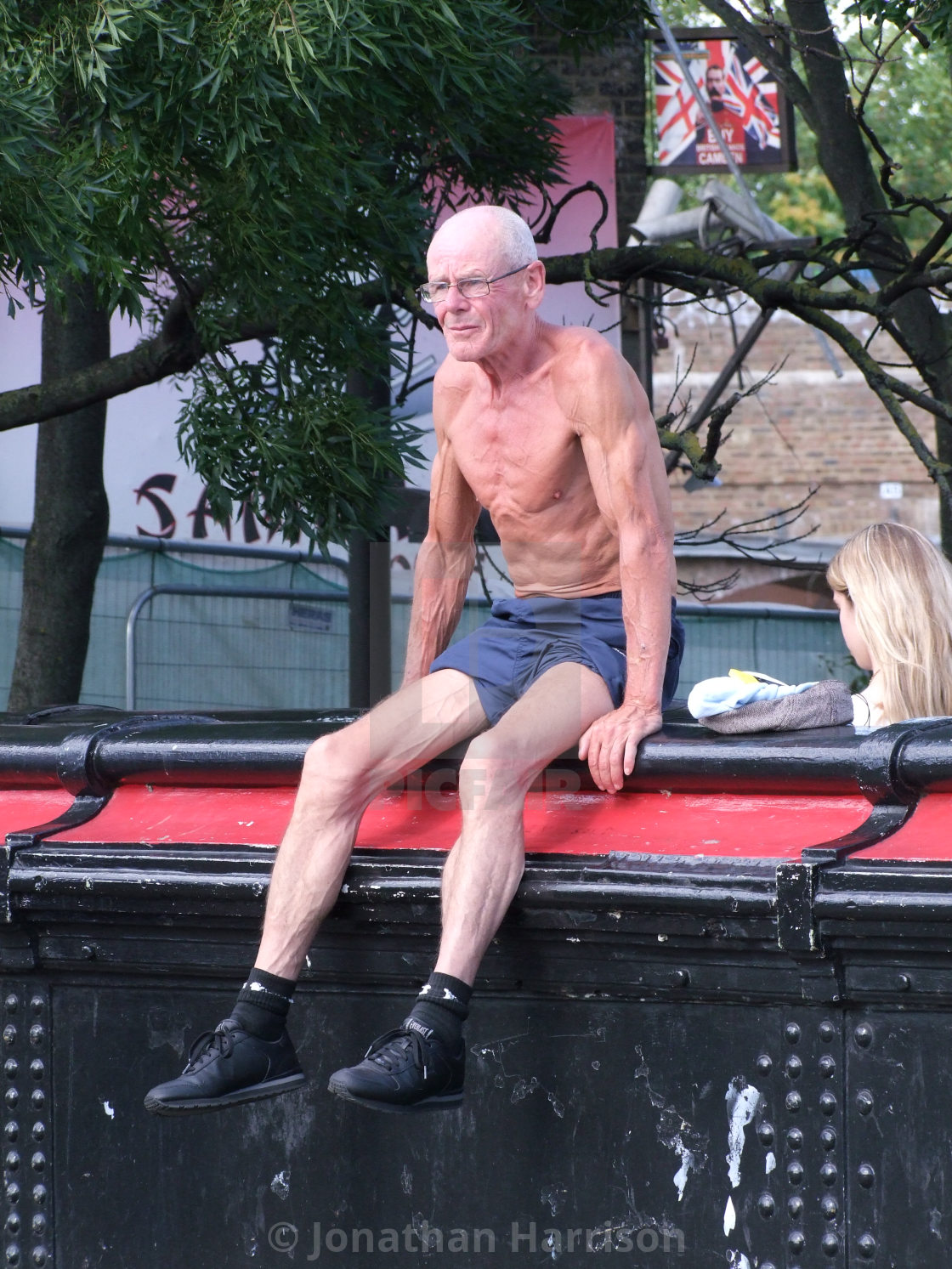 "Bare Chested Man, Camden, London" by Jonathan Harrison - $12.44 "Bare Chested Man, Camden, London" stock image
