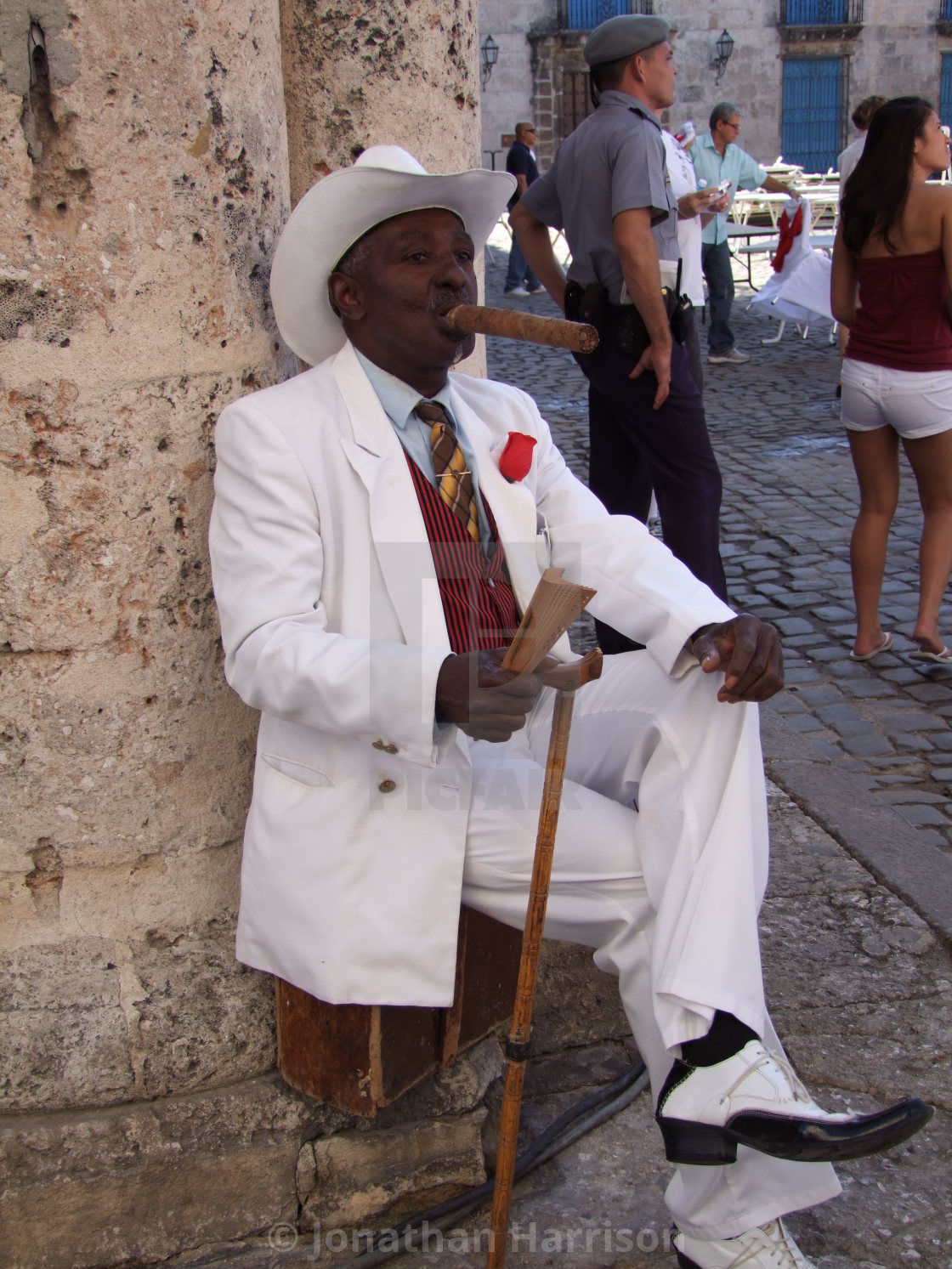 "Cuban Man with Large Cigar, Cathedral Square" by Jonathan Harrison - $12.44 "Cuban Man with Large Cigar, Cathedral Square" stock image