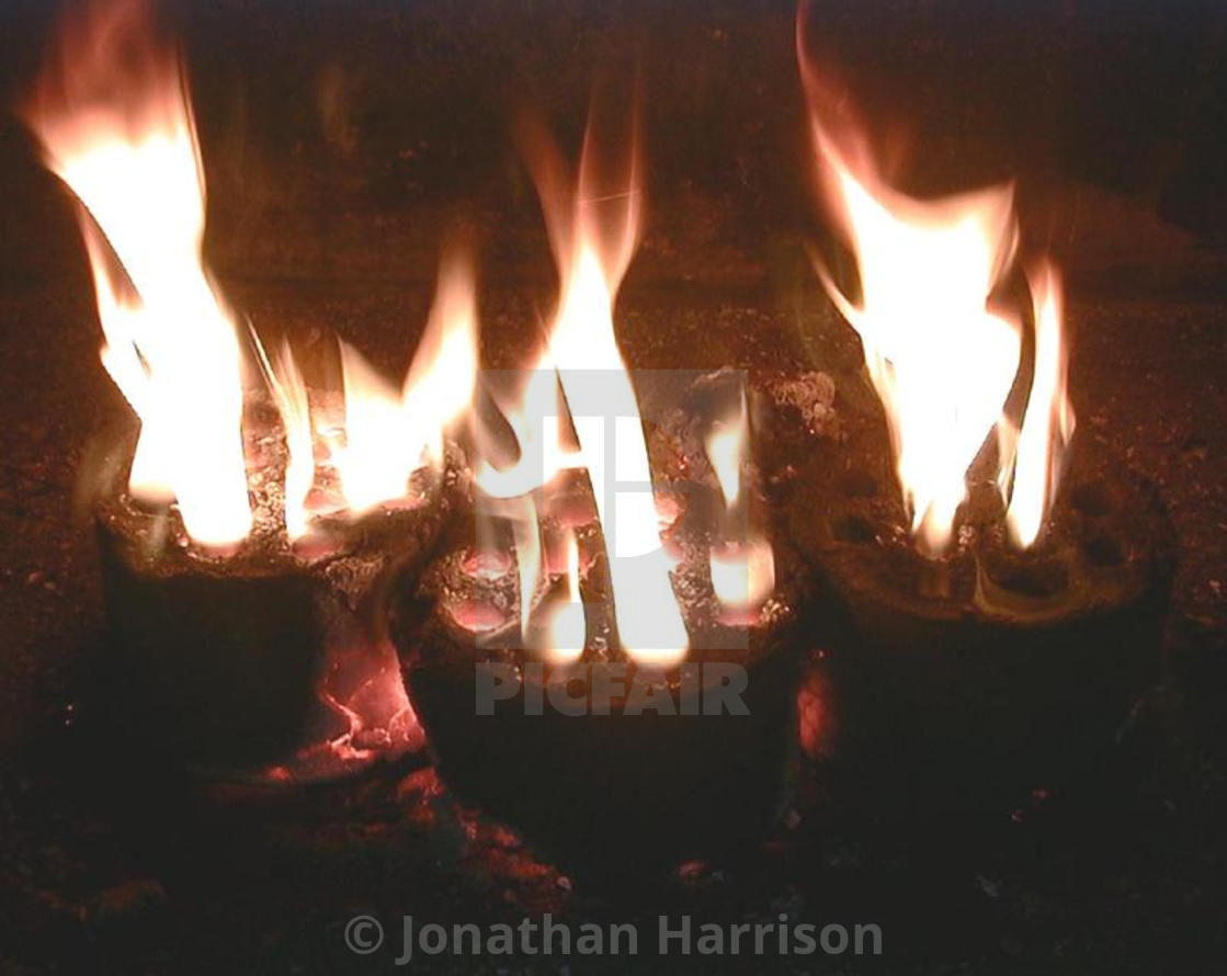 "Three 10 Hole Coal Briquettes Burning, Trzebinia" by Jonathan Harrison - $12.44 "Three 10 Hole Coal Briquettes Burning, Trzebinia" stock image