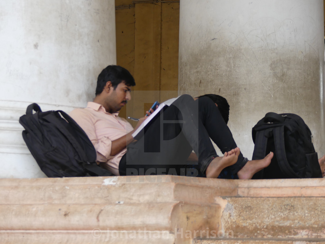 "Indian Man Studying, Madurai" by Jonathan Harrison - $12.44 "Indian Man Studying, Madurai" stock image