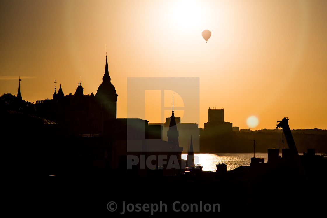 "Hot Air Balloon Above Stockholm Skyline Silhouette at Sunset" by Joseph Conlon - $10.69 "Hot Air Balloon Above Stockholm Skyline Silhouette at Sunset" stock image