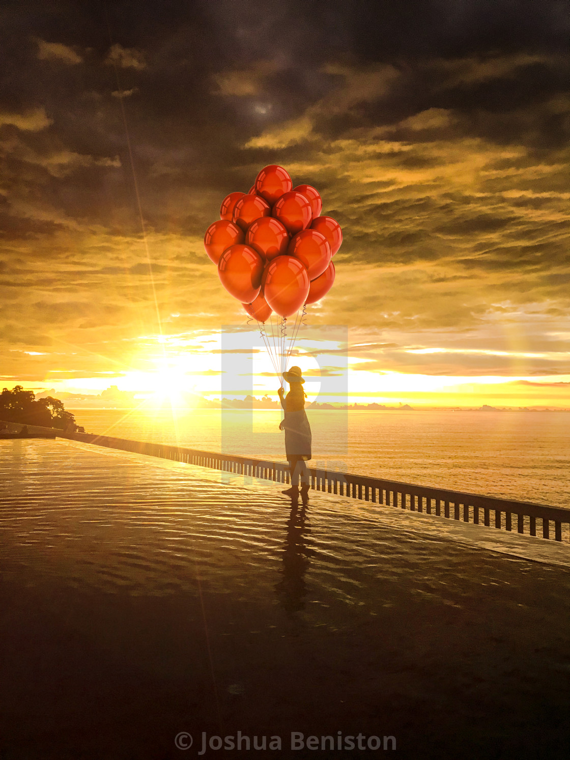 "A Girl, Balloons and a sunset" stock image