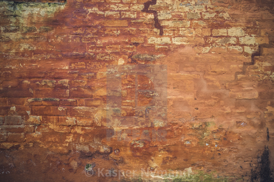 Grunge Brick Wall With Peeling Orange Paint License Download Or
