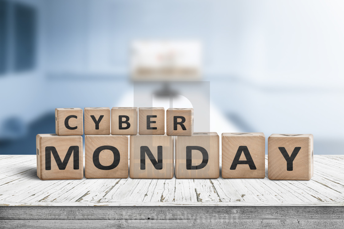 Cyber Monday Sign On A Wooden Desk With A Monitor License