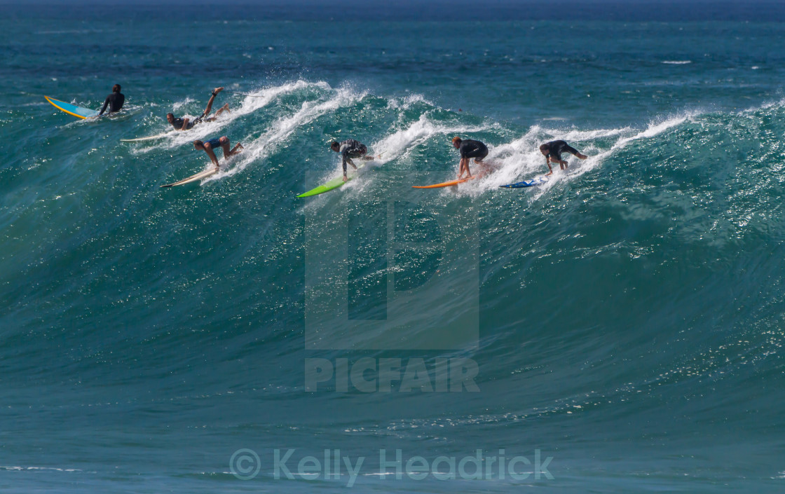 "Surfers at Waimea bay" stock image