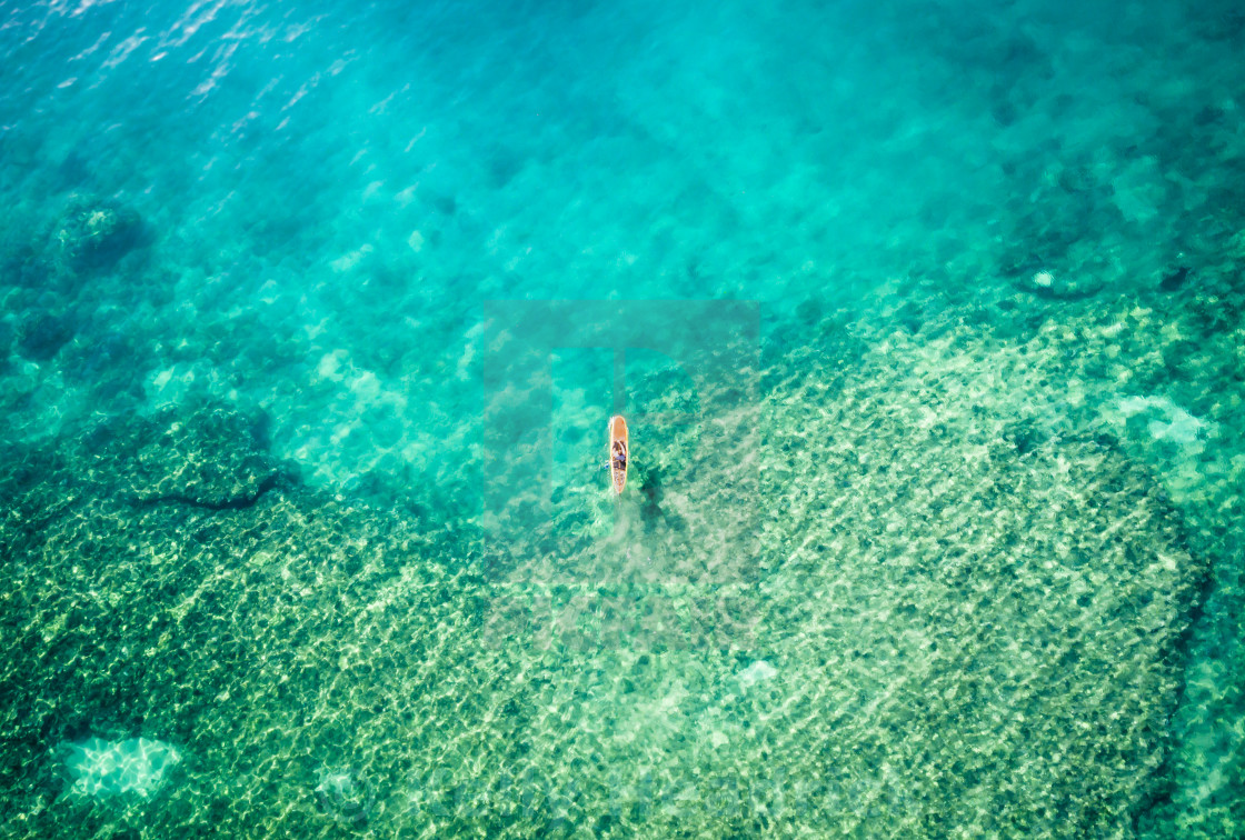 "Aerial view of a paddle boarder" stock image