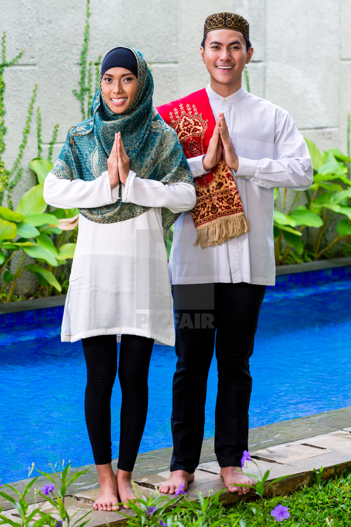 Asian Muslim couple wearing traditional dress - License, download or print  for £ | Photos | Picfair