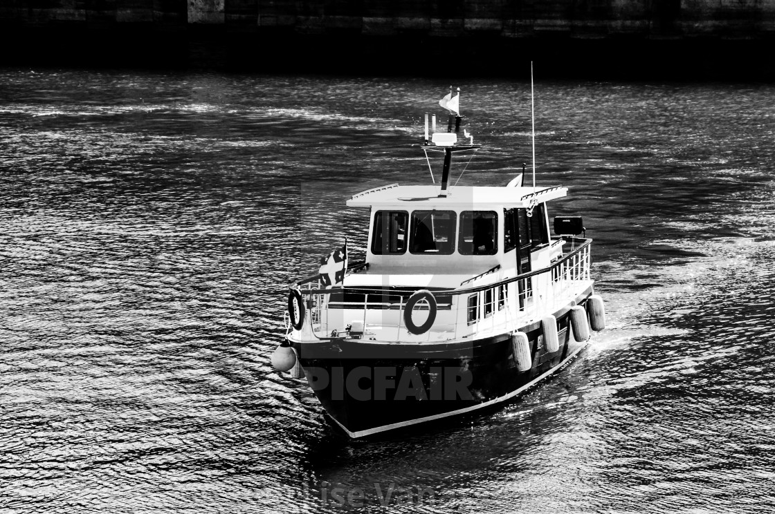 "A boat comes to the port." by Lise Vanasse - $1.52 "A boat comes to the port." stock image