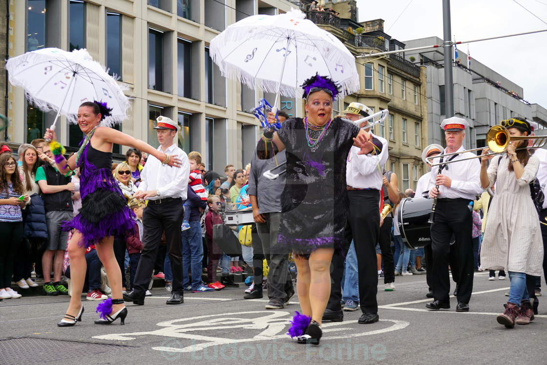 "Woman performs at Edinburgh Jazz festival parade" by Ludovic Farine - $2.44 "Woman performs at Edinburgh Jazz festival parade" stock image