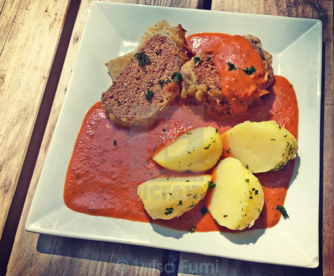 "Minced beef roll with boiled potatoes and tomato sauce" stock image