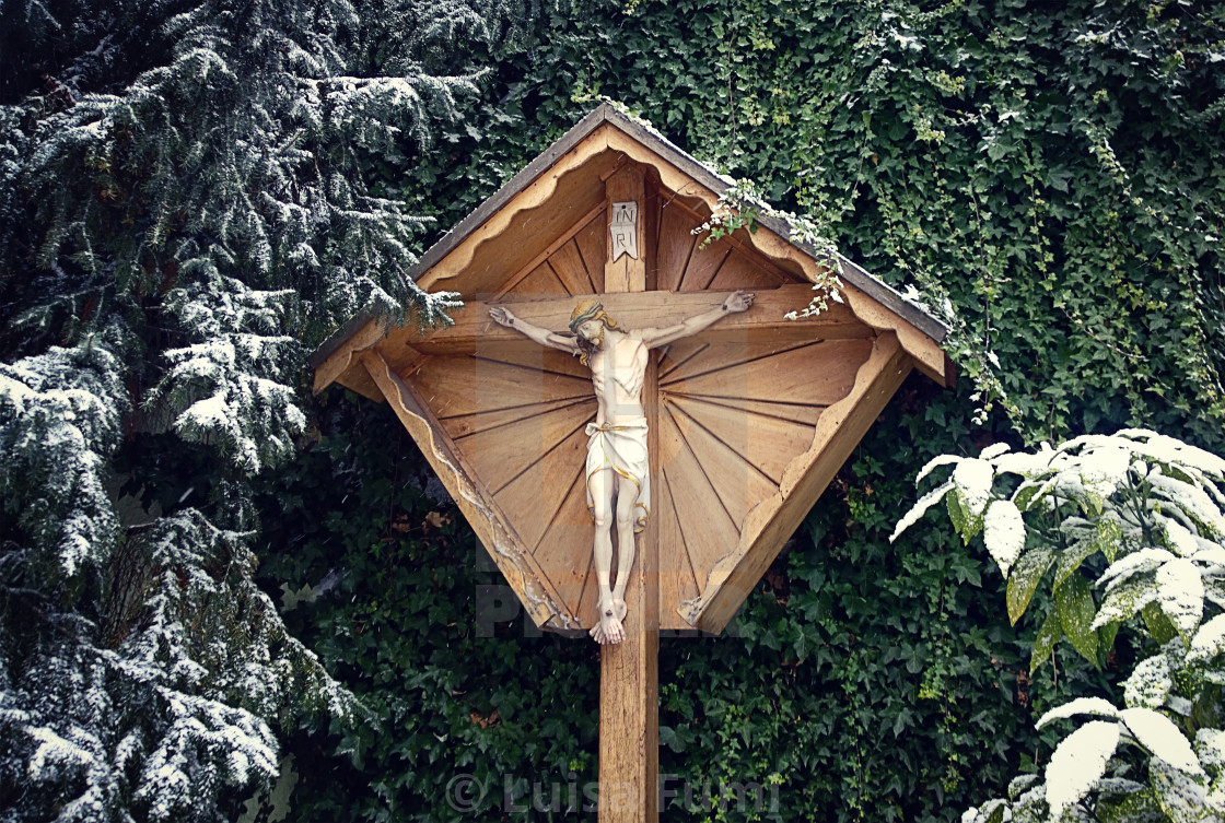 "Small chapel with green and snow" stock image