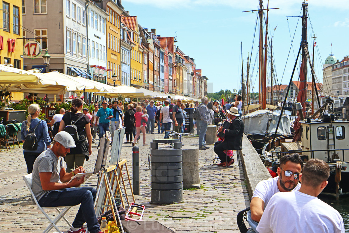 "COPENHAGEN, DENMARK - JUNE 16, 2019 Picturesque summer view of Nyhavn harbor,..." stock image