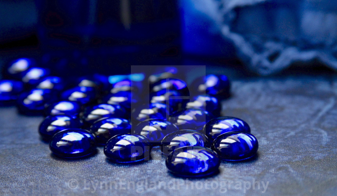 "Classic Blue 2020 ....glass beads in natural light from window" by LynnEnglandPhotography - £7.50 "Classic Blue 2020 ....glass beads in natural light from window" stock image