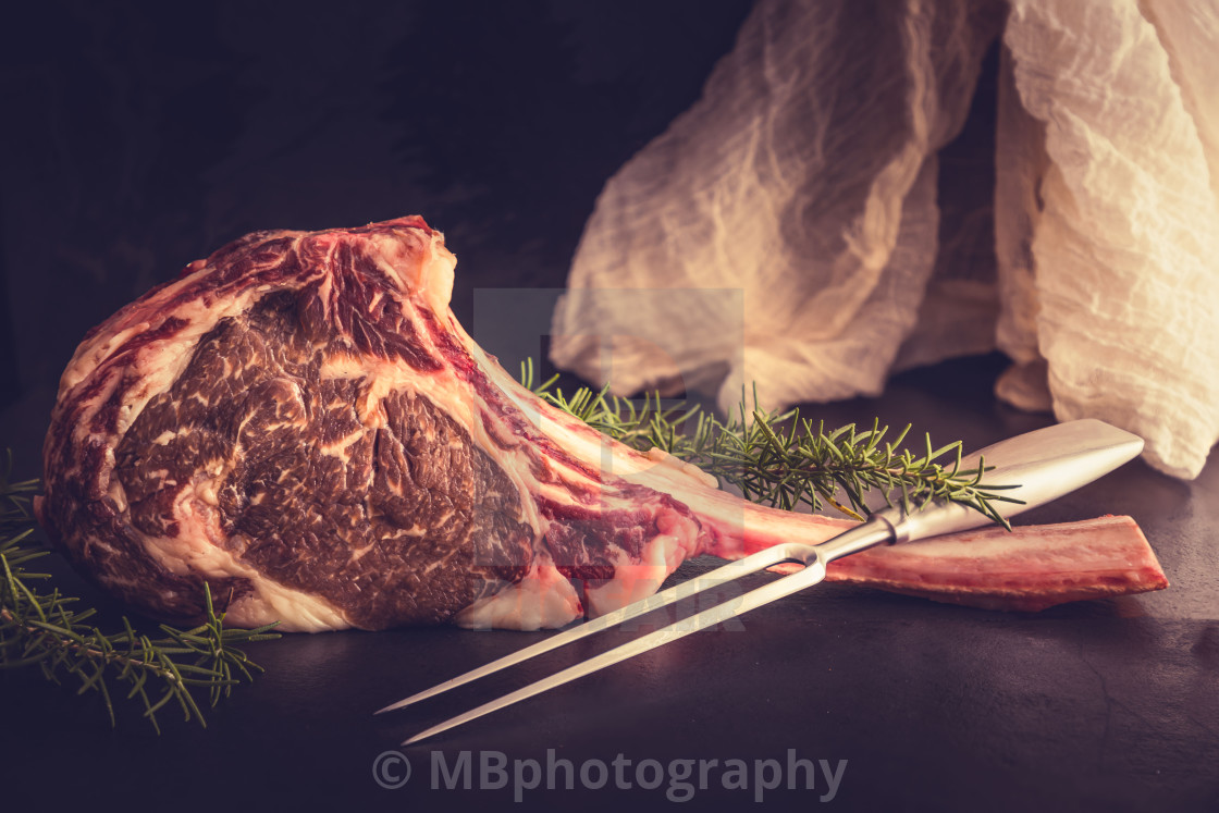 "Raw, dry aged Wagyu Tomahawk steak" stock image