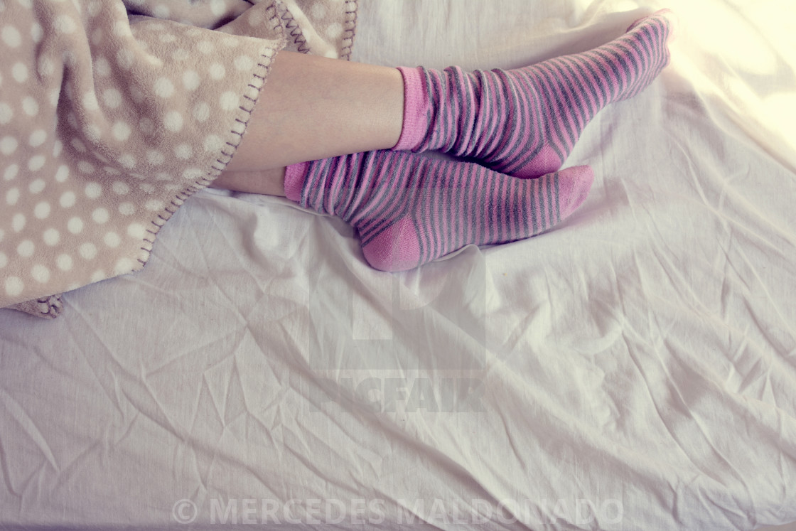 "girl with pink striped socks, sleeping in bed" by MERCEDES MALDO...