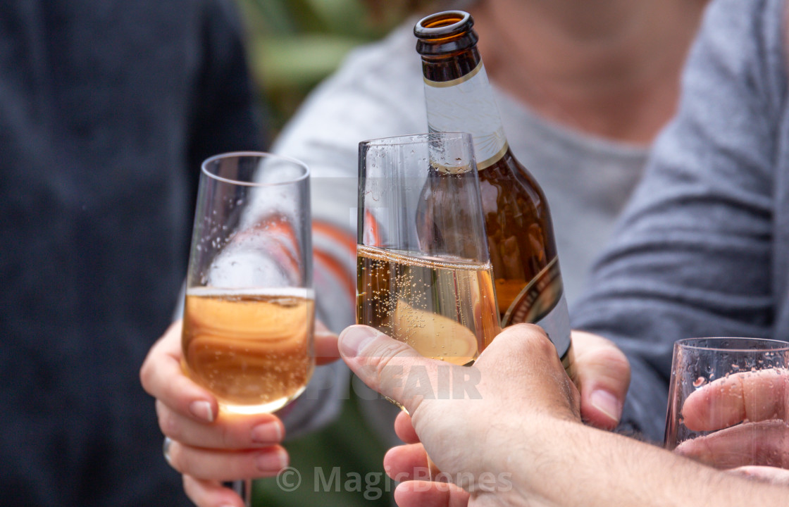 "Friends toasting with drinks" stock image