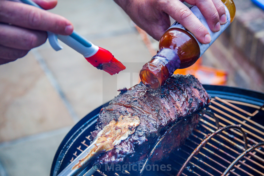 "Cooking marinated baby back ribs" stock image