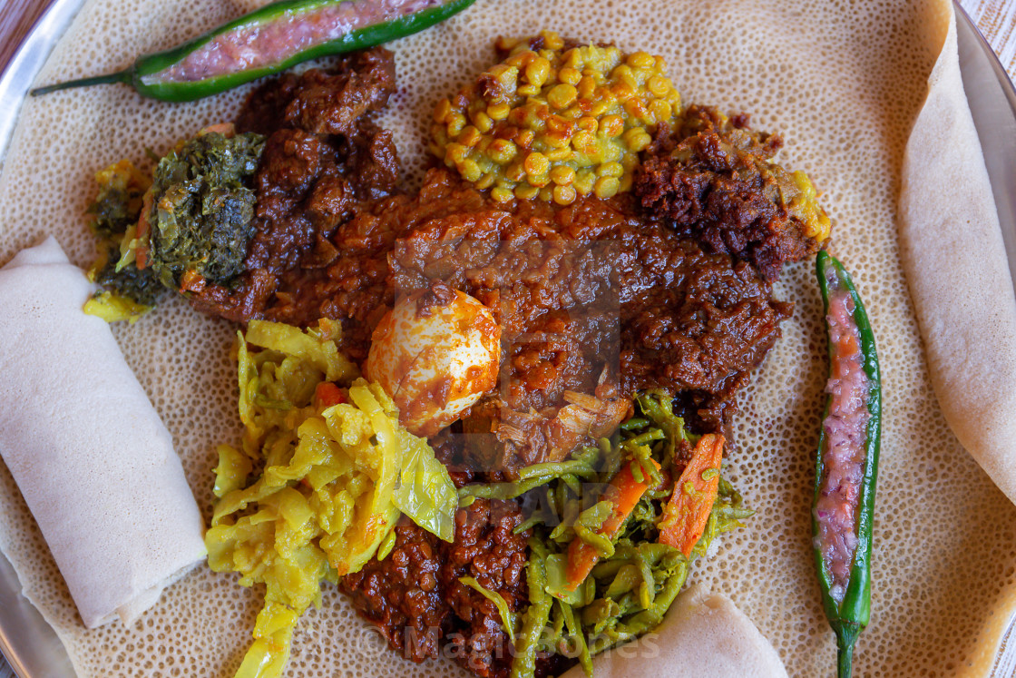 "Injera with an assortment of toppings" stock image