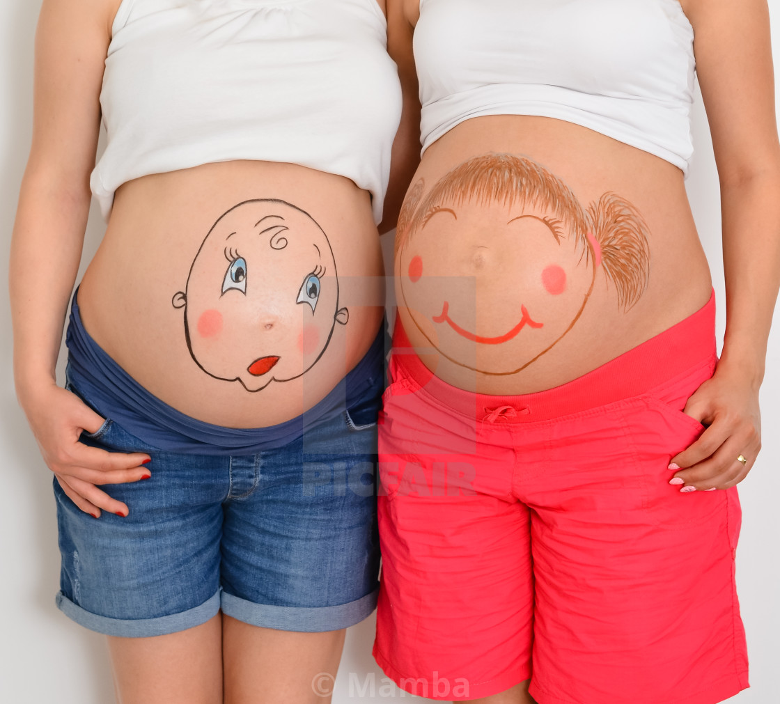 First Childbirth Close Up Belly Of Two Young Caucasian Pregnant