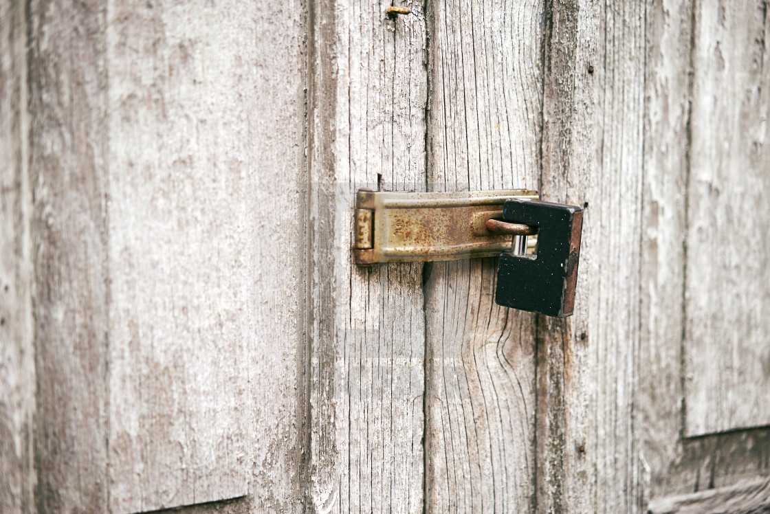 Rusty Black Key Lock On The Old White Door License