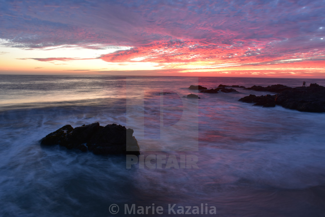 "pink sunset sky reflected in ocean water rocky coast Baja, Mexico" by Marie Kazalia - £12.40 "pink sunset sky reflected in ocean water rocky coast Baja, Mexico" stock image