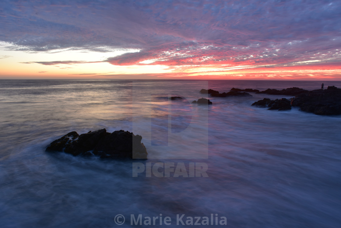 "pink sunset sky reflected in ocean water rocky coast Baja, Mexico" by Marie Kazalia - £12.40 "pink sunset sky reflected in ocean water rocky coast Baja, Mexico" stock image