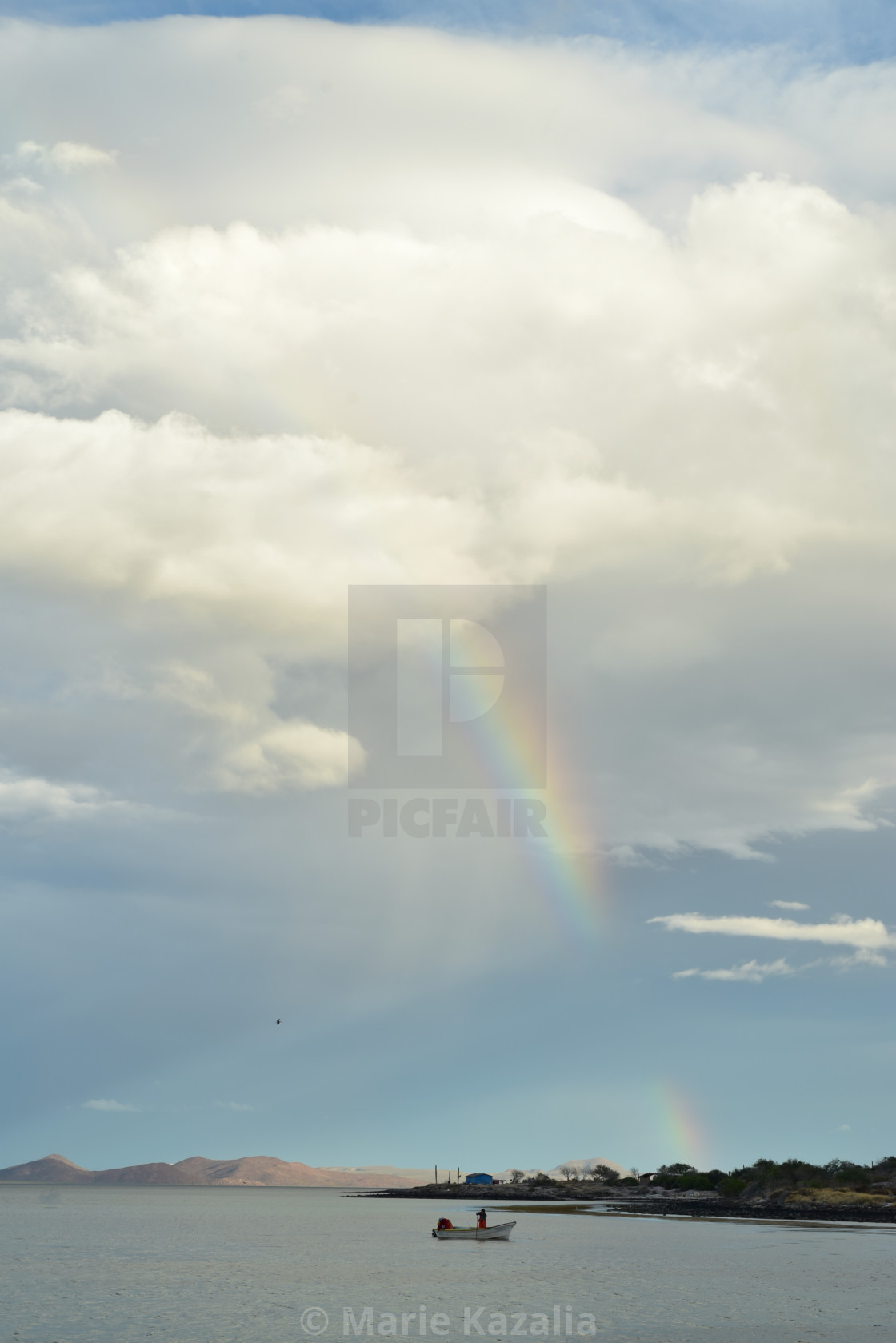 "rainbow in cloudy sky over boat on water of Sea of Cortez, Baja, Mexico" by Marie Kazalia - $15.16 "rainbow in cloudy sky over boat on water of Sea of Cortez, Baja, Mexico" stock image