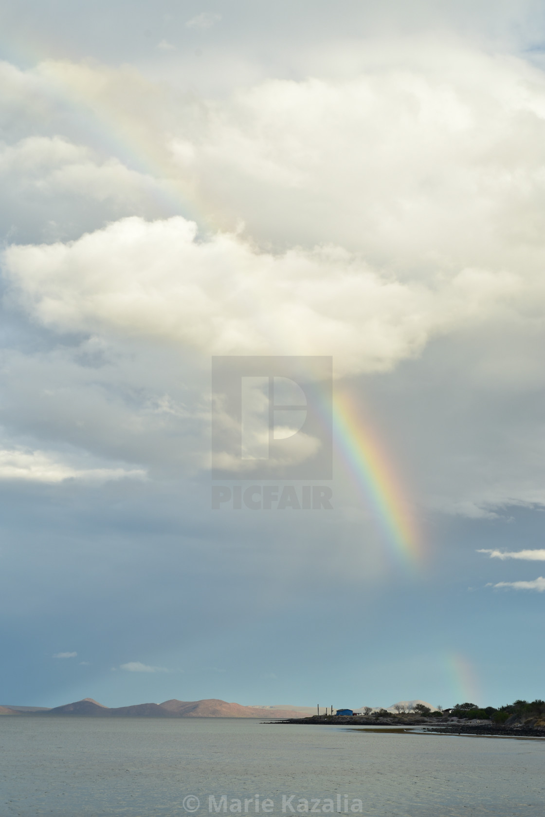 "rainbow in cloudy sky over boat on water of Sea of Cortez, Baja, Mexico" by Marie Kazalia - $15.16 "rainbow in cloudy sky over boat on water of Sea of Cortez, Baja, Mexico" stock image